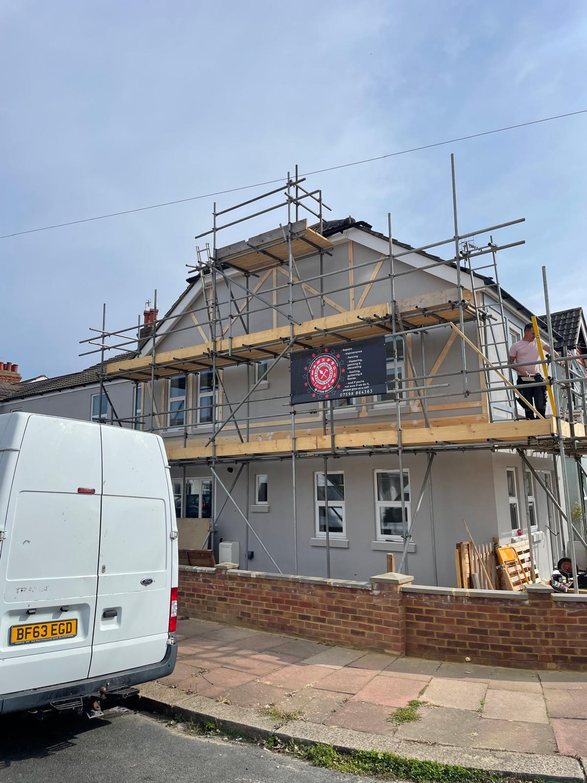 Exterior painting and masonry work on a Sussex property