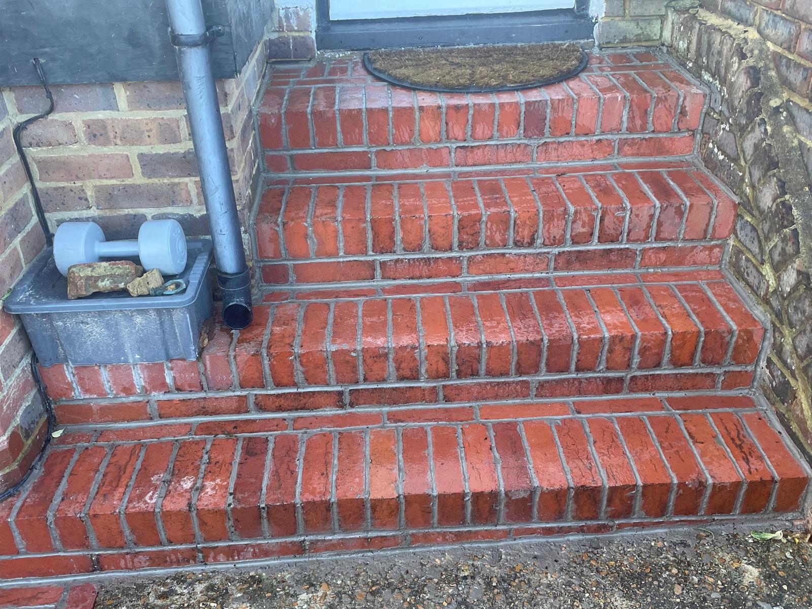 Rebuilt brick steps with fresh pointing